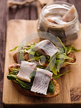 Herring sandwich traditional Danish smorrebrod on cutting boar photo