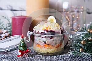 Herring under a Fur Coat. Traditional Russian multilayered salad from herring, beets, potatoes, carrots and eggs.