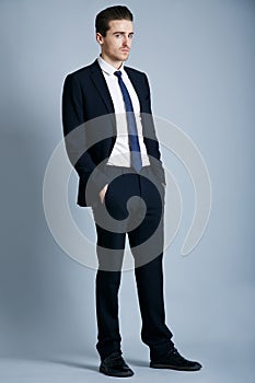 Hes all style. Cropped shot of a handsome and fashionable young man posing in the studio.