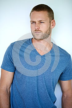 Hes all about the style. Studio shot of a handsome young man posing against a white background.