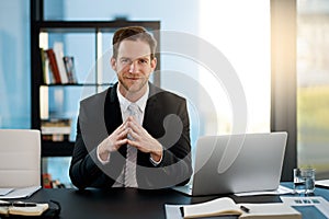 Hes the consummate professional. Portrait of a corporate businessman sitting in his office.