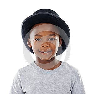 Hes a cool kid. Studio shot of a cute little boy wearing a funky hat against a white background.