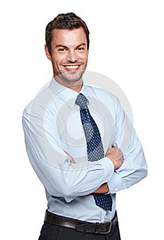 Hes got amazing business acumen. An experienced businessman crossing his arms while isoalted on a white background.