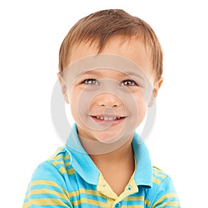 Hes got a bit of mischief in his eyes. Closeup studio portrait of a cute young boy isolated on white.