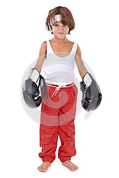 Hes got the boxer spirit. Portrait of a young boy in boxing gear pretending to be a fierce fighter.