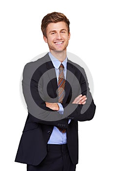 Hes got business confidence. Portrait of a happy young businessman standing with his arms crossed.