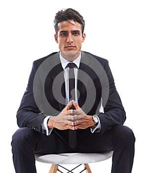 Hes got plenty of business accumen to draw from. Studio shot of a handsome young man posing against a white background.