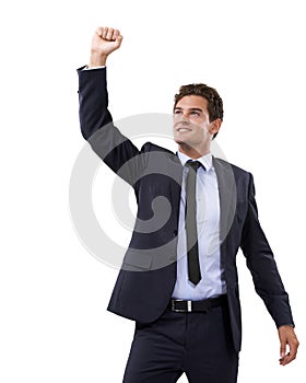 Hes got a winning attitude. A young businessman gesturing in triumph.