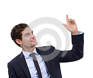 Hes got your words on the tip of his finger. A handsome young businessman pointing at copyspace.