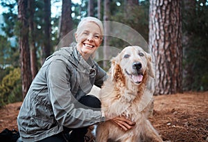 Hes my favourite hiking partner. a senior woman out for a hike with her dog.