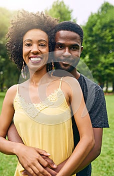 Hes my happily ever after. Cropped portrait of an affectionate young couple spending some time together in the park.