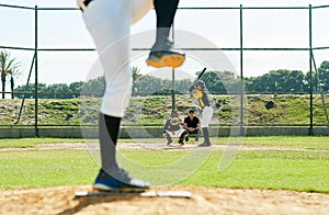 Hes ready for the ball. a young baseball player batting a ball during a match on the field.