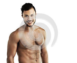 Hes in tiptop shape. Studio portrait of an athletic young man posing against a white background.