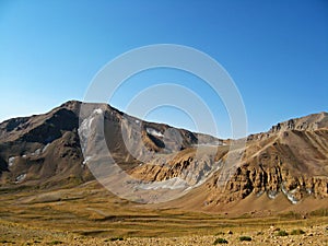 Hesarchal plain and Lashgarak summit in mount Alamkuh , Iran