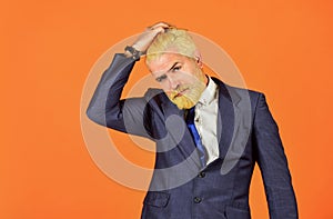 Hesitating businessman touch head. mature men dyed beard and hair. male grooming and personal hygiene. mens beauty