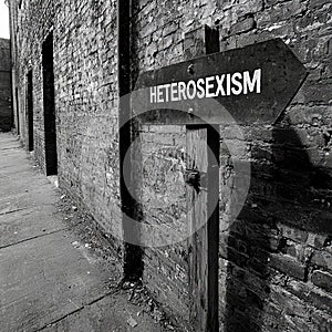 HETEROSEXISM text related to the type of discrimination written on a blackboard