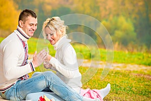 Heterosexual couple relaxing in the park