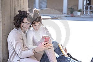 Heterosexual Couple sitting in city break