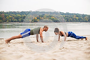 Heterosexual couple work out on the beach
