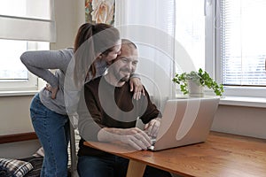 Heterosexual couple working online at home