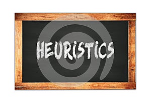 HEURISTICS text written on wooden frame school blackboard photo