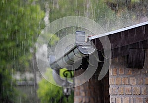 Hevy rain on roof and gutter photo