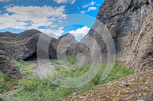 Hexagonal basalt rocks formed Kirkja cave at Hljodaklettar on Iceland