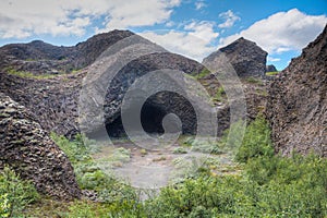 Hexagonal basalt rocks formed Kirkja cave at Hljodaklettar on Iceland