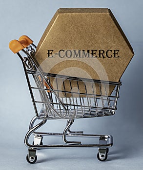 A hexagonal cardboard box inside a shopping trolley.