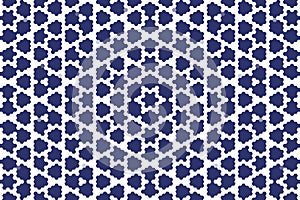Hexagonal floral geometric pattern in midnight blue, forming an abstract pixel art design with structured symmetry. photo