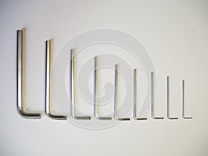 Hexagonal key on a white background. Copy space.