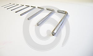 Hexagonal key on a white background. Copy space