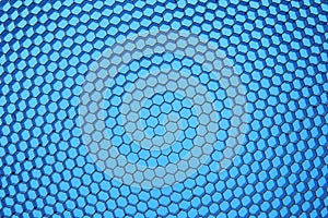 Hexagonal mesh on a blue background.