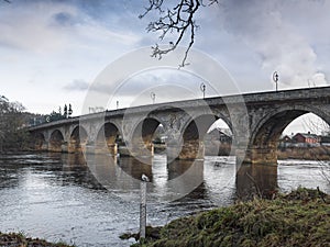 Hexham Bridge over the river Tyne, Northumberland, UK with water level marker