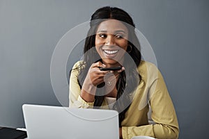 Hey do you have some time. a young businesswoman using her smartphone to make a call.