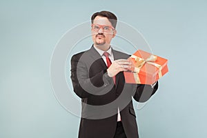 Hey! it`s my present! Greed seriously man holding gift box