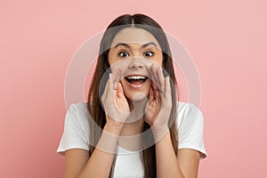 Hey You. Cheerful Teen Girl Keeping Hands Near Mouth And Making Announcement