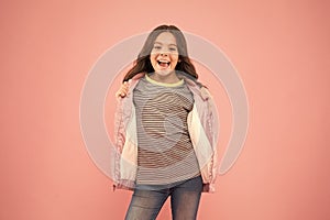 Hey you. Keeping active in fall. You need it for autumn. Happy child show handguns pink background. Little girl with
