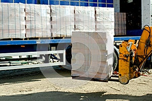 HGV delivered concrete blocks on construction site and telehandler offloading