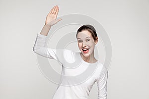 Hi! How are you? Happiness woman showing hello sign