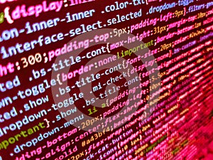 Hi-tech modern screen of data, digits and chars on monitor. IT coding on monitor screen. Closeup of Java Script and HTML code.