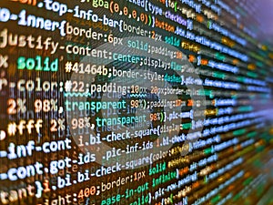 Hi-tech modern screen of data, digits and chars on monitor. Programming code abstract screen of software developer. Code on dark