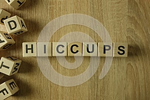 Hiccups word from wooden blocks