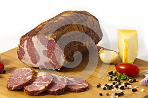 Hickory smoked sliced beef ham stuffed in a net isolated on white background