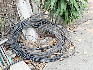 The Hidden Danger: Unused Power Lines Left on the Ground in an Urban Landscape