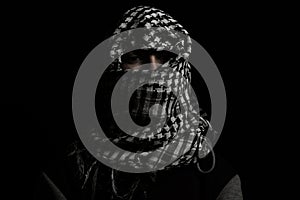 Hidden man with palestinian scarf over head in front of isolated