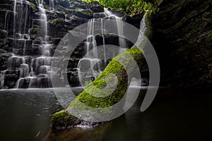 Hidden waterfall in a deep gorge with trickling white water. Forest of Bowland, Ribble Valley, Lancashire