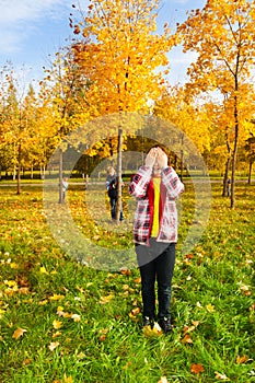 Hide and seek game in the autumn park