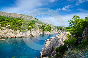 Hiden beach with rocks in Dubrovnik, Croatia photo