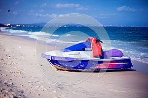 Hidrocycle Jet-ski on beach of the sea against the blue sky photo